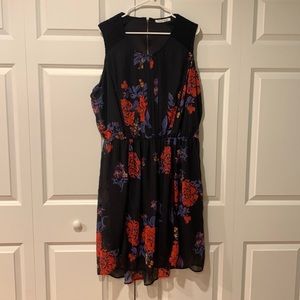Black floral, lace trimmed dress with a slight hi-lo hem
